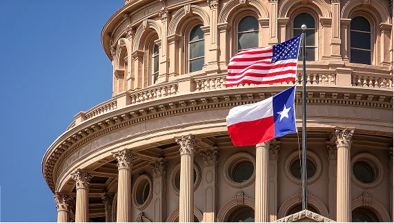 The iconic dome of the Texas State Capitol with the American and Texas flags waving, symbolizing the state's government.